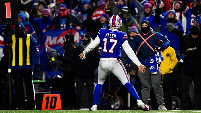 Buffalo Bills quarterback Josh Allen (17) reacts towards the fans after tight end Dawson Knox (88) scores a touchdown during the first half of an NFL wild-card playoff football game. (Adrian Kraus/AP)