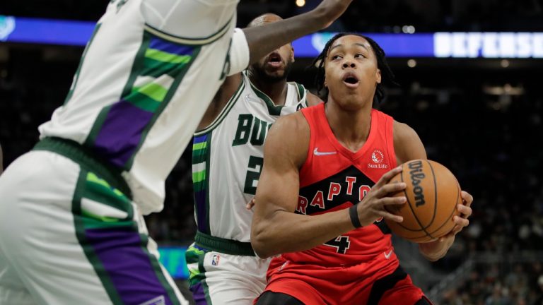 Toronto Raptors' Scottie Barnes looks to shoot between Milwaukee Bucks defenders during the first half of an NBA basketball game Wednesday, Jan. 5, 2022, in Milwaukee. (Aaron Gash/AP)