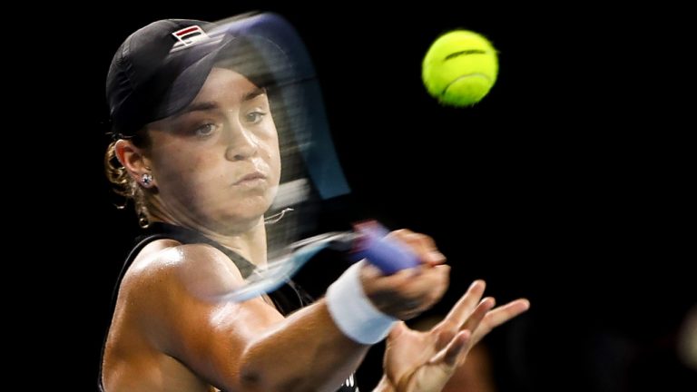 Ashleigh Barty of Australia plays a forehand return to Cori Gauff of the United States during their singles match at the Adelaide International Tennis Tournament, at Memorial Drive, in Adelaide, Australia, Wednesday, Jan. 5, 2022. (Matt Turner/AAP Image via AP)
