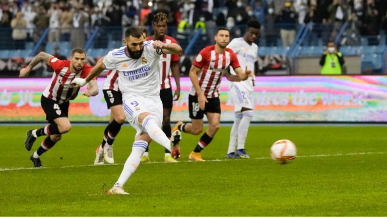 Real Madrid's Karim Benzema scores from a penalty kick during the Spanish Super Cup final soccer match between Real Madrid and Athletic Bilbao at King Fahd stadium in Riyadh, Saudi Arabia, Sunday, Jan. 16, 2022. (Hassan Ammar/AP)