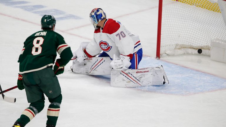 Minnesota Wild defenseman Jordie Benn (8) shoots a goal past Montreal Canadiens goaltender Michael McNiven (70) in the third period of an NHL hockey game. (Andy Clayton-King/AP)