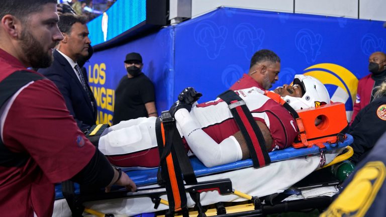 Arizona Cardinals safety Budda Baker is carted off the field during the second half of an NFL wild-card playoff football game against the Los Angeles Rams. (Mark J. Terrill/AP)