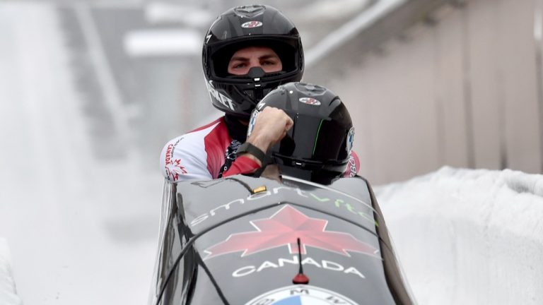 Justin Kripps and Cam Stones from Canada reacts at the Bobsleigh World Cup in Winterberg, Germany, Saturday, Jan. 8, 2022 . (Caroline Seidel/dpa via AP)