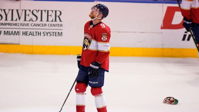 Florida Panthers centre Sam Bennett looks up as fans throw hats on the ice after he scored his third goal of the game during the third period of an NHL hockey game against the Dallas Stars, Friday, Jan. 14, 2022, in Sunrise, Fla. (Wilfredo Lee/AP) 