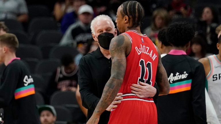 Chicago Bulls forward DeMar DeRozan (11) hugs San Antonio Spurs head coach Gregg Popovich before an NBA basketball game, Friday, Jan. 28, 2022, in San Antonio. (Eric Gay/AP) 