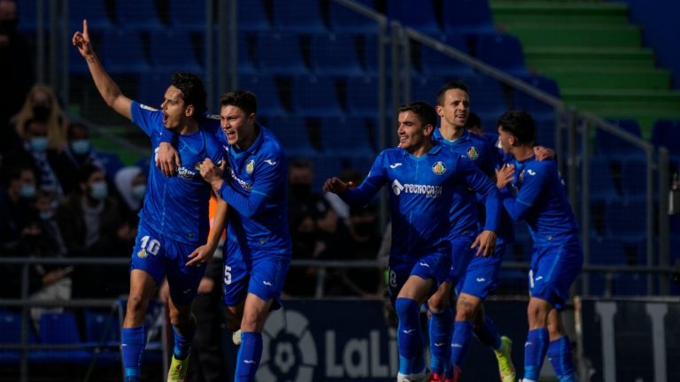 Getafe players celebrate after scoring the opening goal during the La Liga soccer match between Real Madrid and Getafe at Coliseum Alfonso Perez stadium in Getafe, Spain, Sunday, Jan. 2, 2022. (Bernat Armangue/AP)