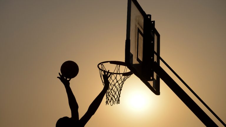 A young basketball player makes a layup during a youth basketball announcement with Prime Minister Justin Trudeau and Toronto Raptors President Masai Ujiri in Dakar, Senegal on Wednesday, Feb. 12, 2020. When the ball is finally tossed up after a roller-coaster four months, Mike Morreale will breathe a sigh of relief. (Sean Kilpatrick/CP)