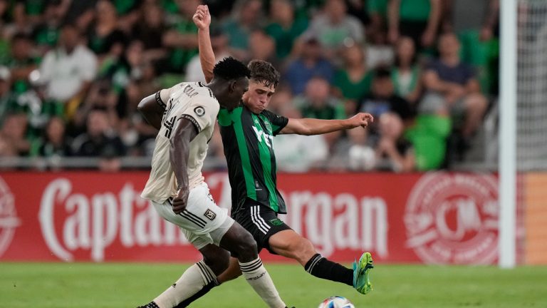 Los Angeles FC defender Jesus Murillo, left, and Austin FC midfielder Sebastian Berhalter, right, vie for the ball during an MLS soccer match, Wednesday, July 7, 2021, in Austin, Texas. (AP Photo/Eric Gay)