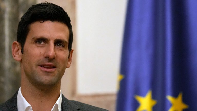 Serbian tennis player Novak Djokovic, left, speaks with Serbia's President Aleksandar Vucic in Belgrade, Serbia, Thursday, Feb. 3, 2022. Serbia's state prosecutors have rejected suggestions that Novak Djokovic used a fake positive test for COVID-19 to try to enter Australia and compete in the Australian Open. (Darko Vojinovic/AP)