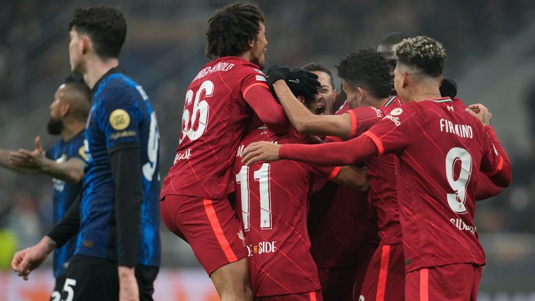Liverpool's Mohamed Salah celebrates with his teammates after scoring his side's second goal during the Champions League, round of 16, first leg soccer match between Inter Milan and Liverpool at the San Siro stadium in Milan, Italy, Wednesday, Feb. 16, 2022. (Antonio Calanni/AP)