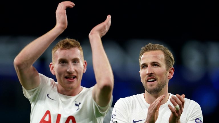 Tottenham's Harry Kane, right, applauds to supporters with teammate Dejan Kulusevski. (Jon Super/AP)