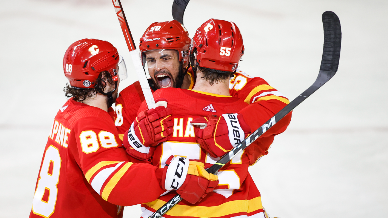 Flames defence uses big hits, big goals to secure win in ‘playoff-type game’ thumbnail