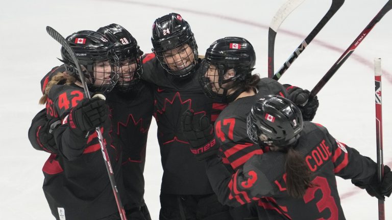 Team Canada players (left to right)Claire Thompson (42) Sarah Nurse (20), Natalie Spooner (24) Jamie Lee Rattray (47) and Jocelyne Larocque (3) celebrate a goal against Sweden during second period women's quarter-final round hockey action at the Beijing Winter Olympics in Beijing, China, on Friday, Feb. 11, 2022. (Ryan Remiorz/THE CANADIAN PRESS)