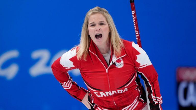 Canadian skip Jennifer Jones calls for the sweep on her shot as they face the team from the Russian Olympic Committee at the 2022 Winter Olympics in Beijing on Monday, February 14, 2022. (Paul Chiasson/THE CANADIAN PRESS)