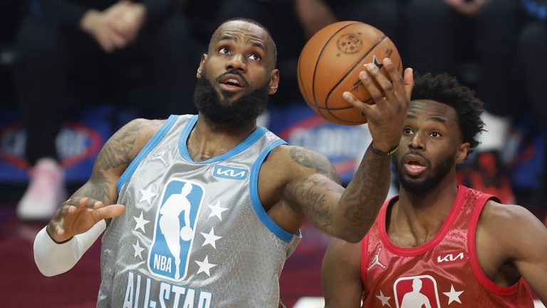 Los Angeles Lakers' LeBron James, left, puts up a shot in front of Golden State Warriors' Andrew Wiggins during the first half of the NBA All-Star basketball game. (Ron Schwane/AP)