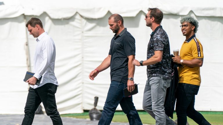 Cincinnati Reds' pitcher Sonny Gray, from left, St. Louis Cardinals' Paul Goldschmidt, Los Angeles Dodgers' Max Scherzer and New York Mets' Francisco Lindor arrive at Roger Dean Stadium in Jupiter, Fla., for baseball labor negotiations, Tuesday, Feb. 22, 2022. (Greg Lovett/The Palm Beach Post via AP)