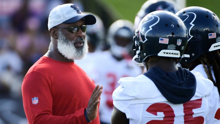 Texans associate head coach/defensive coordinator Lovie Smith talks with players during NFL football practice Saturday, July 31, 2021, in Houston. (Justin Rex/AP)