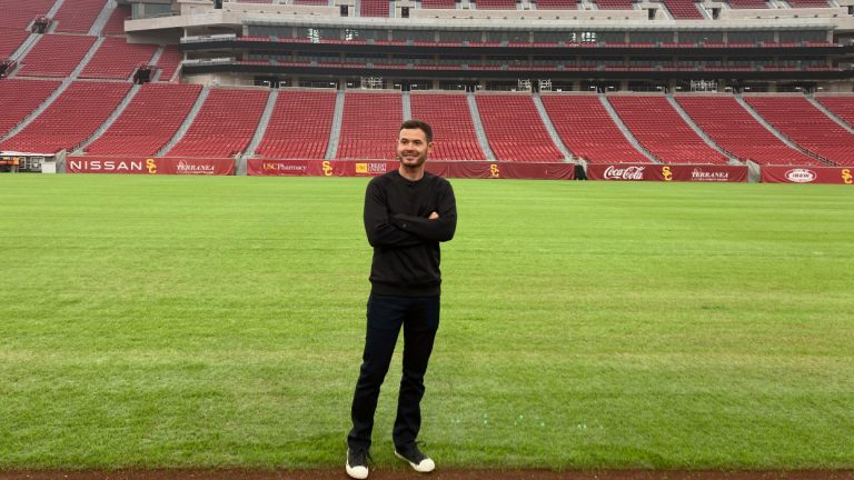 NASCAR driver Kyle Larson poses at United Airlines Field at Los Angeles Memorial Coliseum, Tuesday, Nov. 9, 2021, two days after winning the NASCAR Cup Series championship in Avondale, Ariz. Larson was the first driver to get an up-close look at what NASCAR plans when it shifts to the season-opening exhibition Busch Clash Feb. 6 on a purpose-built track inside the Coliseum. Larson, as the champion, is the only driver locked into the field so far. (Jenna Fryer/AP)