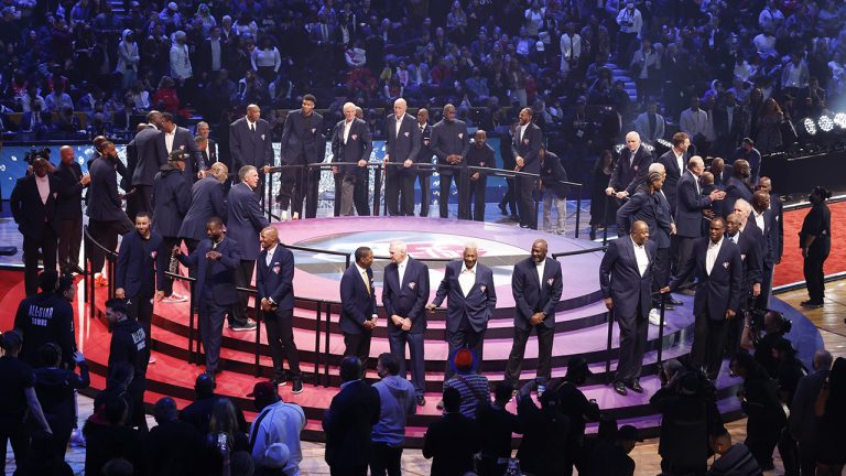 75 of the leagues greatest players gather on a stage during halftime at of the NBA All-Star basketball game. (Ron Schwane/AP)