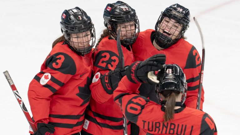 Team Canada forward Sarah Nurse (20) celebrates with teammates after scoring her third goal of the game against Finland during third period women's ice hockey action Saturday, February 5, 2022 at the Winter Olympics in Beijing. (Ryan Remiorz/THE CANADIAN PRESS)