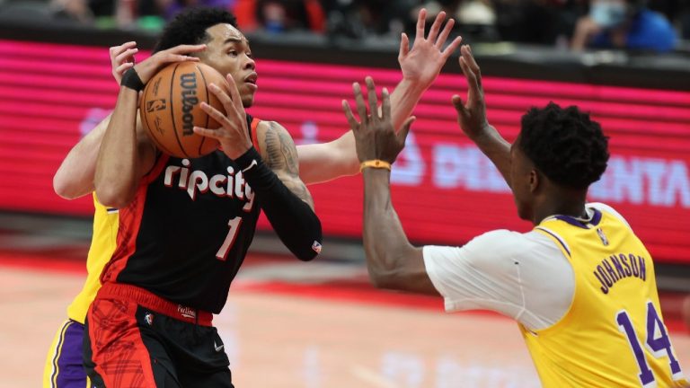 Portland Trail Blazers guard Anfernee Simons, left, looks to shoot as Los Angeles Lakers forward Stanley Johnson, right, defends during the second half of an NBA basketball game in Portland, Ore., Wednesday, Feb. 9, 2022. The Trail Blazers won 107-105. (Steve Dipaola/AP)