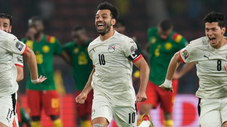 Egypt's Mohamed Salah, centre, and teammates celebrate during the African Cup of Nations 2022 semifinal soccer match between Cameroon and Egypt at the Olembe stadium in Yaounde, Cameroon, Thursday, Feb. 3, 2022. (Themba Hadebe/AP)