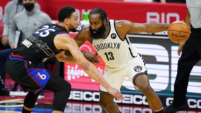 Brooklyn Nets' James Harden (13) tries to drive past Philadelphia 76ers' Ben Simmons (25) during the second half of an NBA basketball game. (Matt Slocum/AP)