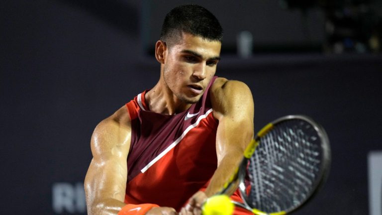 Carlos Alcaraz of Spain returns the ball to Jaume Munar of Spain during Rio Open Tennis tournament match in Rio de Janeiro, Brazil, Monday, Feb. 14, 2022. (Silvia Izquierdo/AP)