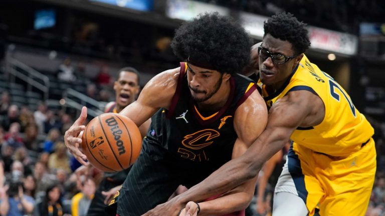 Cleveland Cavaliers' Jarrett Allen (31) grabs a rebound next to Indiana Pacers' Jalen Smith during the second half of an NBA basketball game Friday, Feb. 11, 2022, in Indianapolis. The Cavaliers won 120-113. (Darron Cummings/AP)