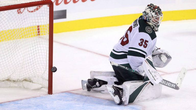 Winnipeg Jets' Joe Morrow (70), not shown, scores on Minnesota Wild goaltender Andrew Hammond (35) during third period NHL hockey action. (Trevor Hagan/CP)