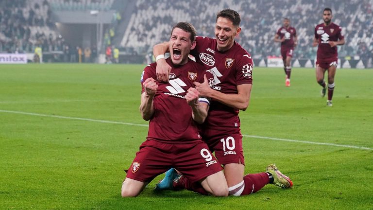 Torino's Andrea Belotti, left, celebrates after scoring a goal during an Italian Serie A soccer match between Juventus and Torino in the Juventus Stadium in Turin, Italy, Friday, Feb. 18, 2022. (Spada/LaPresse via AP)