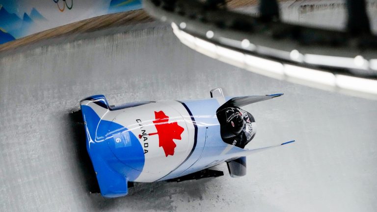 Christine De Bruin and Kristen Bujnowski, of Canada, slide during the women's bobsleigh heat 3 at the 2022 Winter Olympics, Saturday, Feb. 19, 2022, in the Yanqing district of Beijing. (Pavel Golovkin/AP Photo)