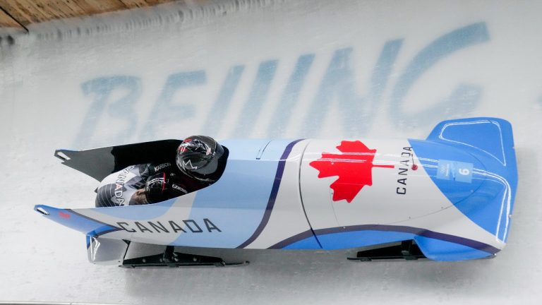Christine De Bruin and Kristen Bujnowski, of Canada, slide during the women's bobsleigh heat 2 at the 2022 Winter Olympics, Friday, Feb. 18, 2022, in the Yanqing district of Beijing. (Mark Schiefelbein/AP Photo)