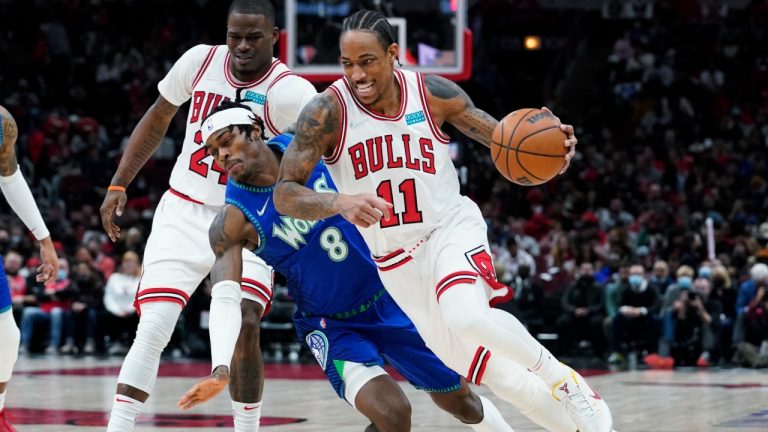 Chicago Bulls forward DeMar DeRozan, right, drives past Minnesota Timberwolves forward Jarred Vanderbilt during the second half of an NBA basketball game in Chicago, Friday, Feb. 11, 2022. (Nam Y. Huh/AP)