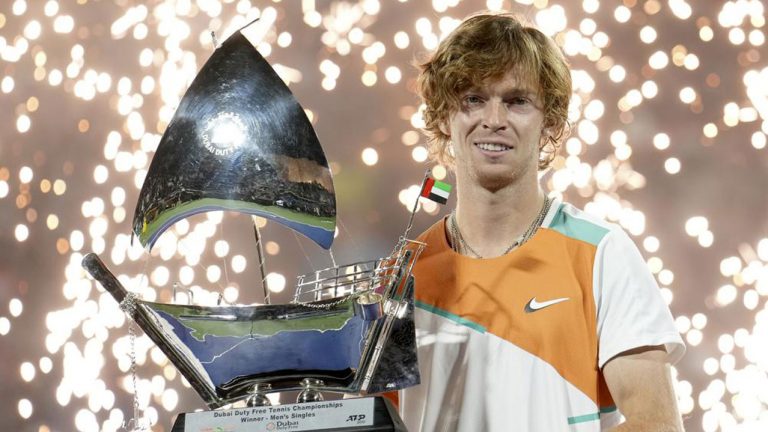 Russia's Andrey Rublev holds the trophy after defeating Czech Republic's Jiri Vesely during the final match of the Dubai Duty Free Tennis Championship. (Ebrahim Noroozi/AP)