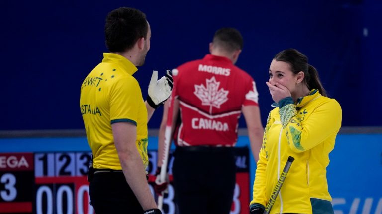 Australia's Tahli Gill and Dean Hewitt, react after winning the mixed doubles curling match against Canada, at the 2022 Winter Olympics, Sunday, Feb. 6, 2022, in Beijing. (Nariman El-Mofty/AP)
