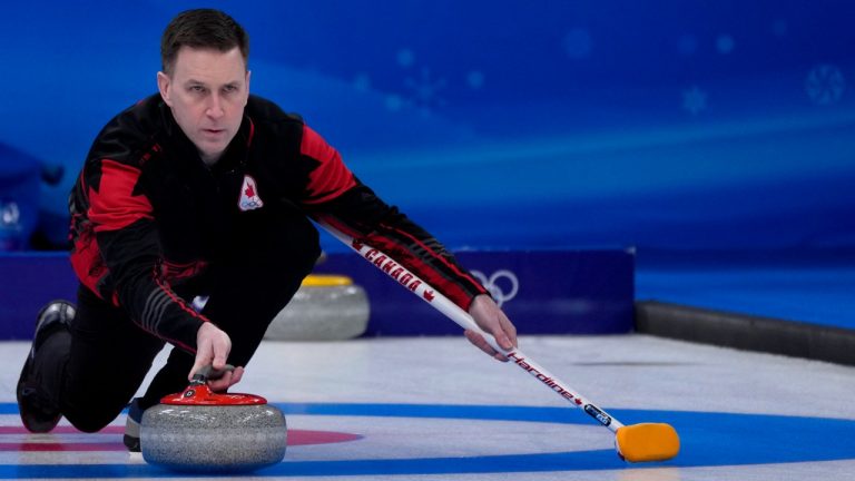Canada's Brad Gushue, throws a rock, during the men's curling match against Switzerland, at the 2022 Winter Olympics, Friday, Feb. 11, 2022, in Beijing. (Nariman El-Mofty/AP)