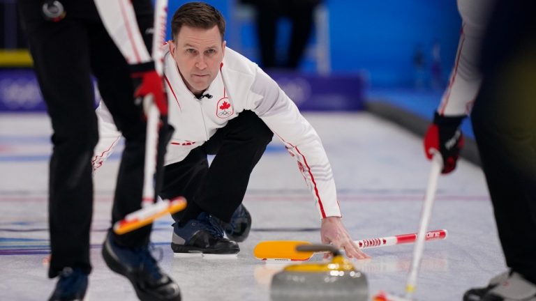 Canada's Brett Gallant watches the rock after playing a delivery during a men's curling semifinal match between Canada and Sweden at the Beijing Winter Olympics Thursday, Feb. 17, 2022, in Beijing. (Brynn Anderson/AP)