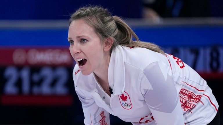 Canada's Rachel Homan, directs her team mate John Morris, as he sweeps the ice during the mixed doubles match, at the 2022 Winter Olympics, Saturday, Feb. 5, 2022, in Beijing. (Nariman El-Mofty/AP)