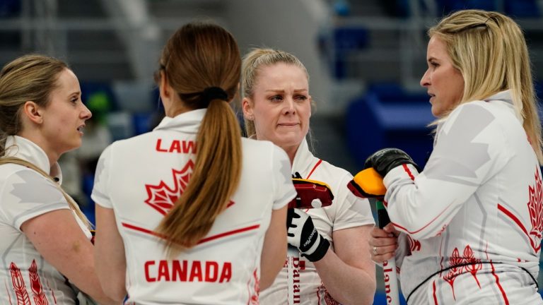 Team Canada talks between ends during a women's curling match against Sweden at the Beijing Winter Olympics Saturday, Feb. 12, 2022, in Beijing. (Brynn Anderson/AP)