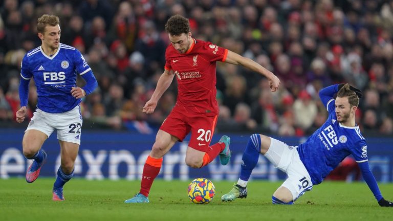 Liverpool's Diogo Jota, second left, challenges for the ball with Leicester's James Maddison, second right, during the English Premier League soccer match between Liverpool and Leicester City at Anfield stadium in Liverpool, England, Thursday, Feb. 10, 2022. (Jon Super/AP)