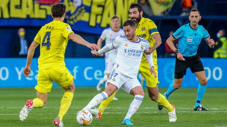 Real Madrid's Eden Hazard, center, vies for the ball with Villarreal's Pau Torres during a Spanish La Liga soccer match between Villarreal and Real Madrid at the Ceramica stadium. (Alberto Saiz/AP)