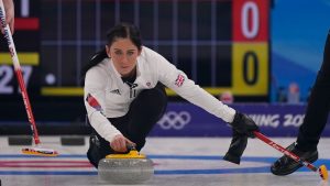 Britain's Eve Muirhead throws a rock during the women's curling final match between Japan and Britain at the Beijing Winter Olympics Sunday, Feb. 20, 2022, in Beijing. (Brynn Anderson/AP)