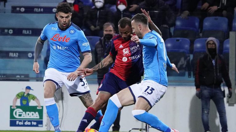 Cagliari's Joao Pedro and Napoli's Amir Rrahmani, right, battle for the ball during the Serie A soccer match between Cagliari Calcio and SSC Napoli at Unipol Domus stadium. (Alessandro Tocco/AP)