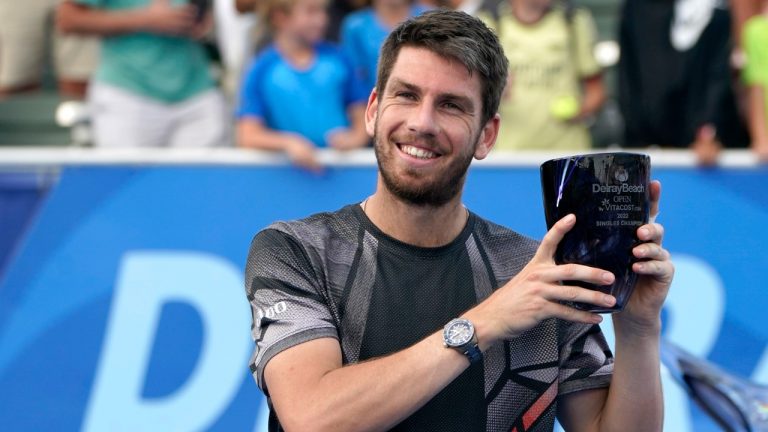 Cameron Norrie of Britain poses with his trophy after defeating Reilly Opelka during the final at Delray Beach Open tennis tournament, Sunday, Feb. 20, 2022, in Delray Beach, Fla. (Lynne Sladky/AP)