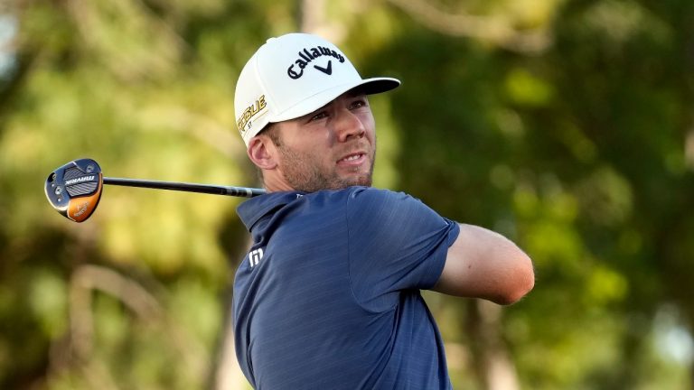 Sam Burns hits his tee shot on the 18th hole during the final round of the Valspar Championship golf tournament Sunday, March 20, 2022, at Innisbrook in Palm Harbor, Fla. Burns won the tournament in a playoff. (Chris O'Meara/AP Photo)