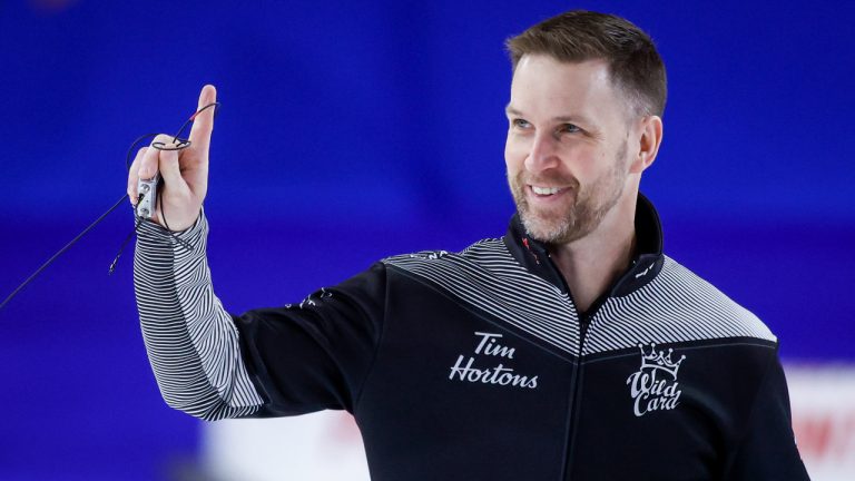 Team Wild Card One skip Brad Gushue celebrates after defeating Team Canada during semifinal action at the Tim Hortons Brier in Lethbridge, Alta., Sunday, March 13, 2022. (Jeff McIntosh/AP)