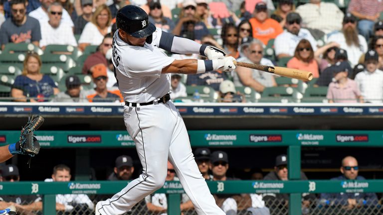 Detroit Tigers' Isaac Paredes hits a ground rule double, scoring pinch runner Zack Short, against the Kansas City Royals in the ninth inning of a baseball game, Sunday, Sept. 26, 2021, in Detroit. (Jose Juarez/AP)