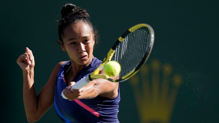 Leylah Fernandez, of Canada, returns a shot to Shelby Rogers at the BNP Paribas Open tennis tournament Tuesday, Oct. 12, 2021, in Indian Wells, Calif. (AP Photo/Mark J. Terrill)