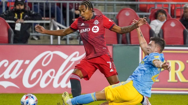 Toronto FC midfielder Jahkeele Marshall-Rutty is tackled by Philadelphia Union defender Kai Wagner during second half MLS action. (Evan Buhler/CP)
